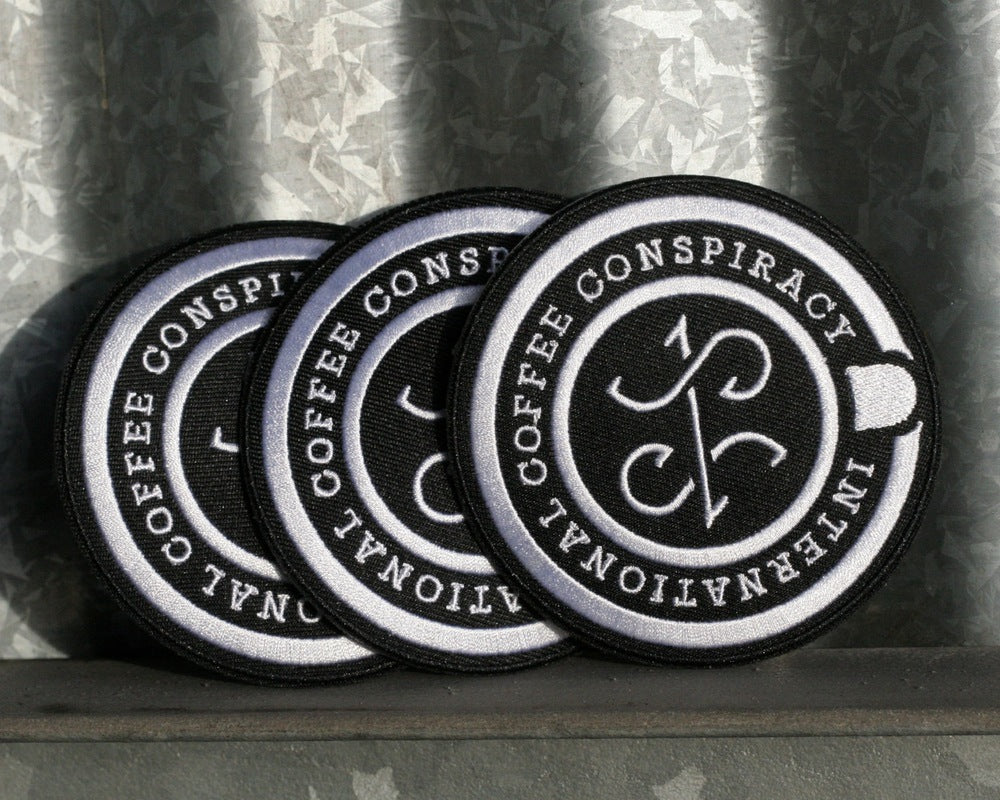 INTERNATIONAL COFFEE CONSPIRACY EMBROIDERED PATCH